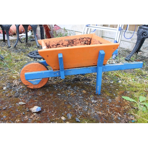 562 - A handmade wheelbarrow planter (a/f).