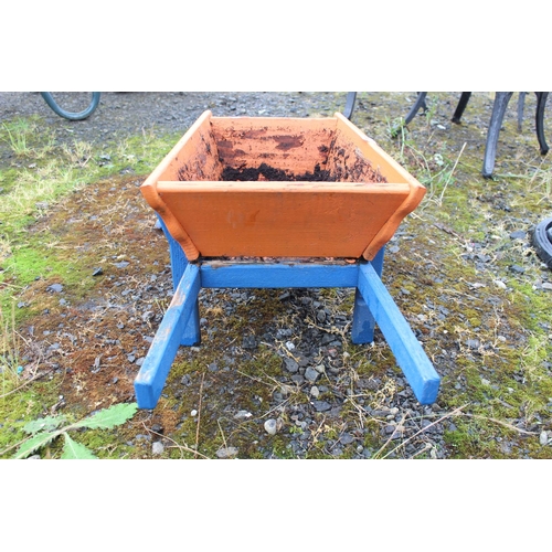 562 - A handmade wheelbarrow planter (a/f).