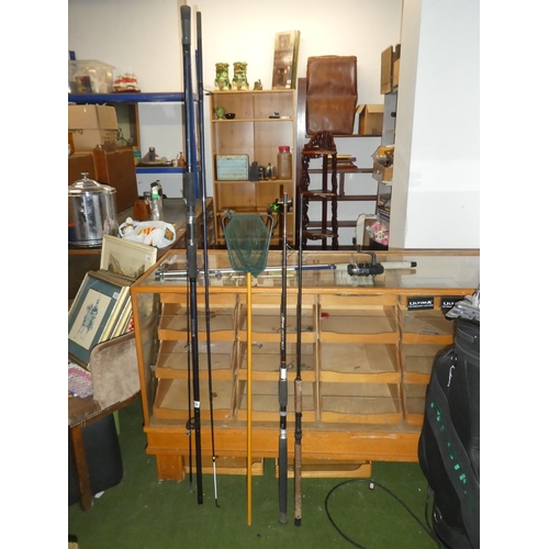 A large lot of fishing equipment to include a Targa Beachcaster 360 fishing  rod and other rods.