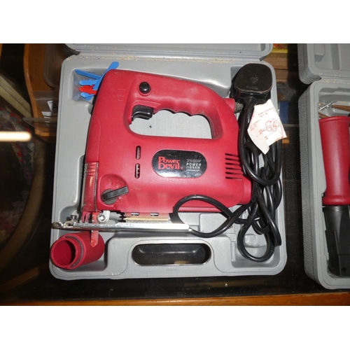 A cased Power Devil 710w Power Jigsaw and Hammer Drill