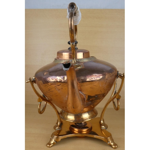 142 - A copper spirit kettle with ceramic handle (a/f).