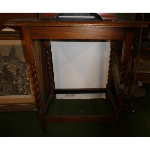 156 - A mahogany occasional table with barley twist legs.