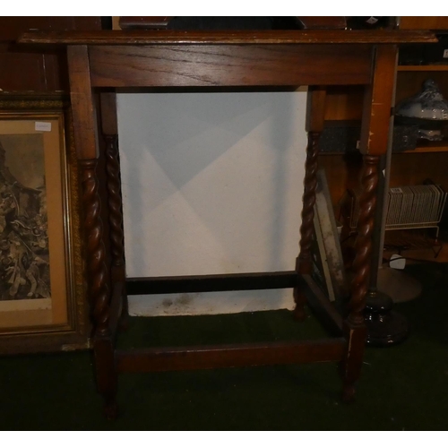 156 - A mahogany occasional table with barley twist legs.