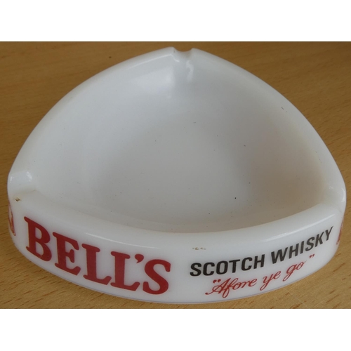 166 - A vintage Bell's Scotch Whisky glass ashtray, and two others.