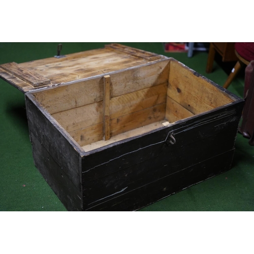 275 - An antique wood trunk.