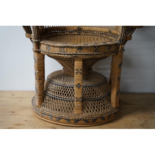 288 - A stunning vintage rattan peacock style armchair.