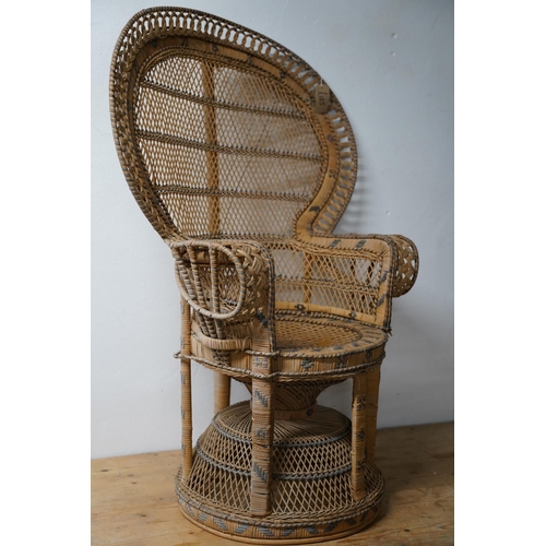 288 - A stunning vintage rattan peacock style armchair.