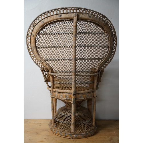 288 - A stunning vintage rattan peacock style armchair.