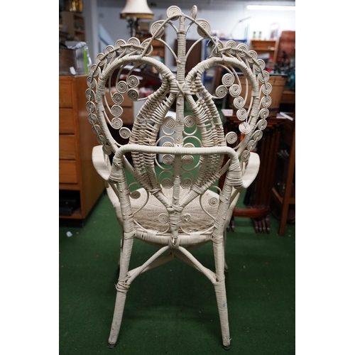 305 - A vintage painted rattan chair.