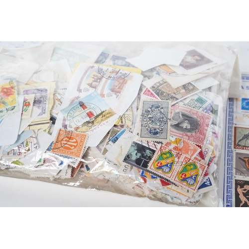 394 - A lot of various World postage stamps and a Greece Souvenir card.