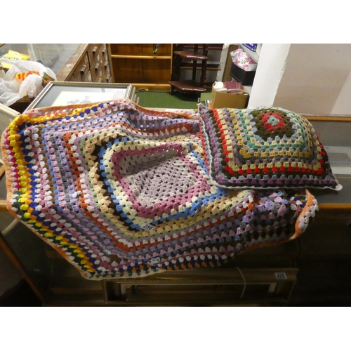 440 - A vintage hand knit blanket and cushion.