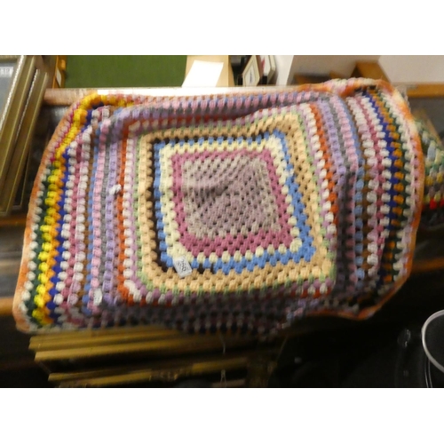 440 - A vintage hand knit blanket and cushion.