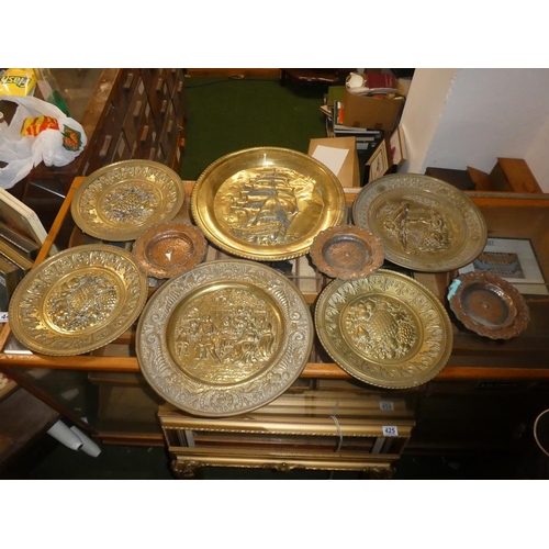 447 - A lot of assorted brass chargers and more.