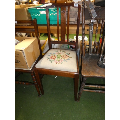 475 - A vintage mahogany chair with carved panel and tapestry seat.