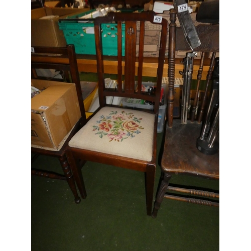 475 - A vintage mahogany chair with carved panel and tapestry seat.