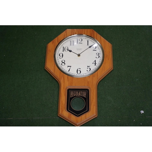 515 - A pine framed Verichron Quartz regulator clock.