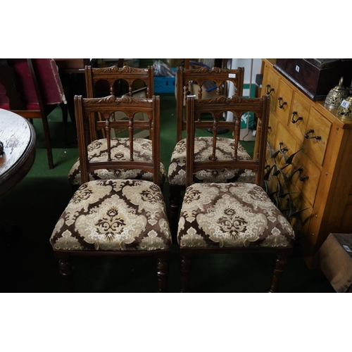 524 - A stunning set of four antique oak upholstered dining room chairs with carved detail.