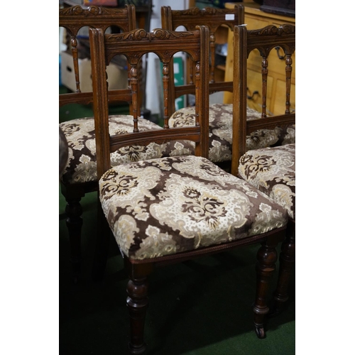 524 - A stunning set of four antique oak upholstered dining room chairs with carved detail.