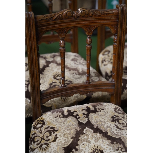 524 - A stunning set of four antique oak upholstered dining room chairs with carved detail.