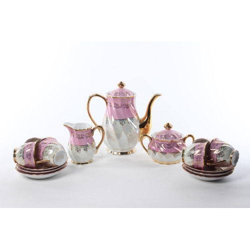 100 - A vintage Roxy China tea set, to include a tea pot, milk jug, sugar bowl, cups and saucers.