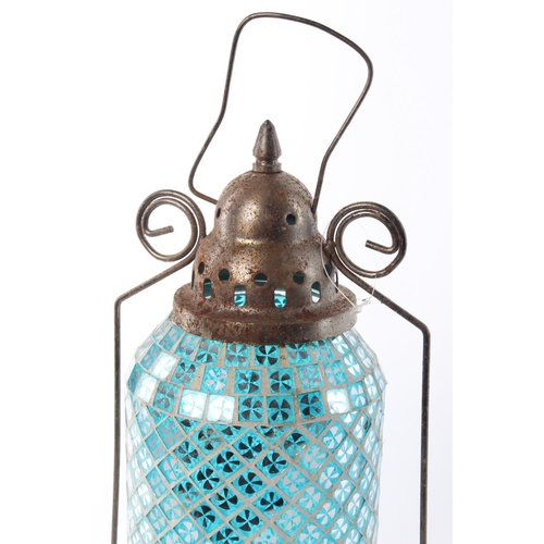 12 - A decorative hanging glass lantern.