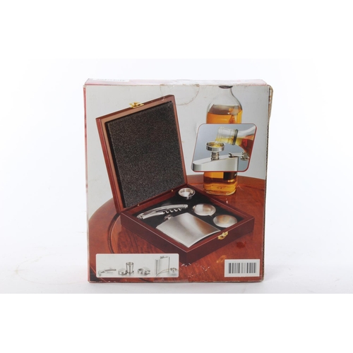 22 - A hipflask box set, to include a hip flask, spout, cups and corkscrew.