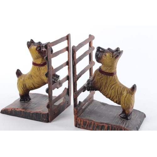 37 - A pair of cast metal bookends, modelled as dogs.