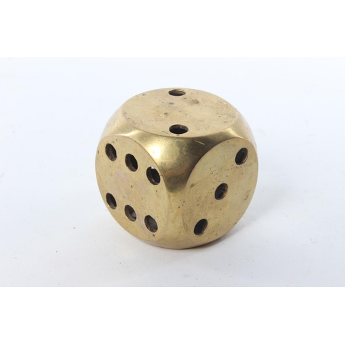 39 - A large brass dice.