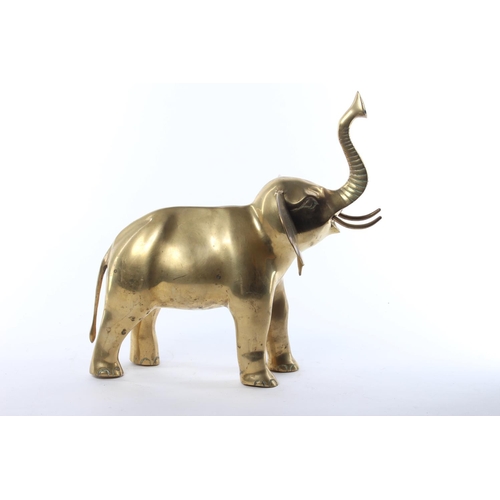 50 - A large brass model of an elephant. Approx  33x33cm.