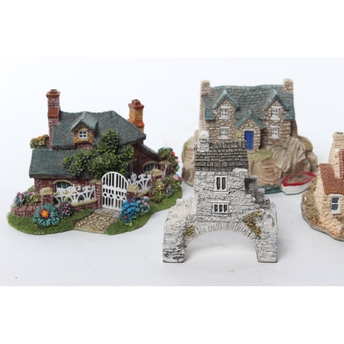 63 - An assortment of model houses by Lilliput Lane and Fraser Creations.