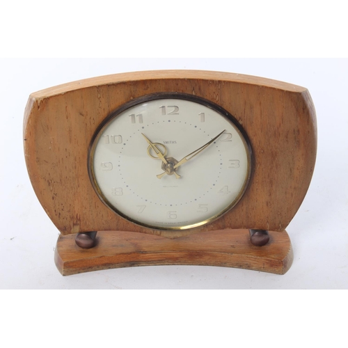 70 - A decorative wood cased mantle clock designed by Smiths Sectronic.