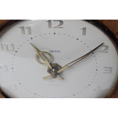 70 - A decorative wood cased mantle clock designed by Smiths Sectronic.