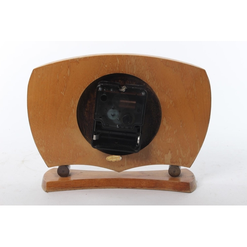 70 - A decorative wood cased mantle clock designed by Smiths Sectronic.