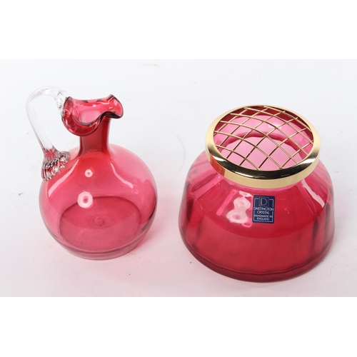 74 - A ruby glass jug and a ruby glass Dartington vase.