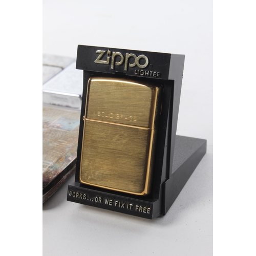 77 - A vintage silver-plated cigarette case and a collection of lighters, to include Zippo and more.