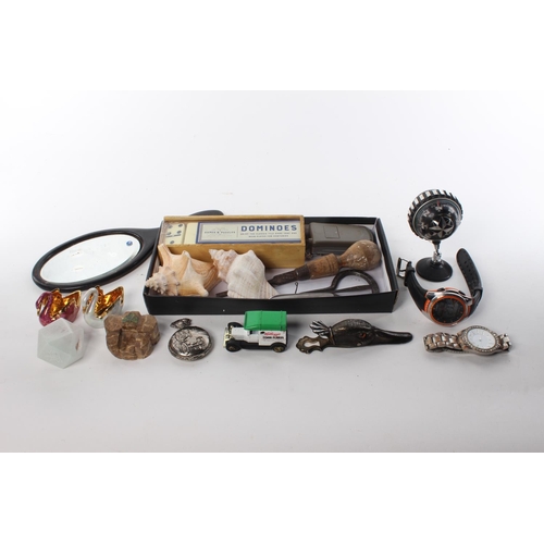 81 - An assortment of items to include seashells, watches, ceramics and more.