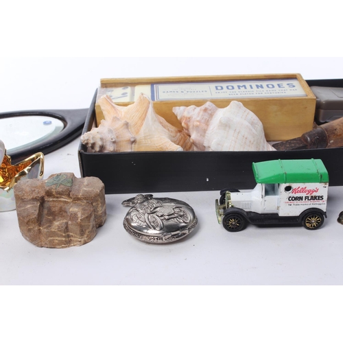 81 - An assortment of items to include seashells, watches, ceramics and more.