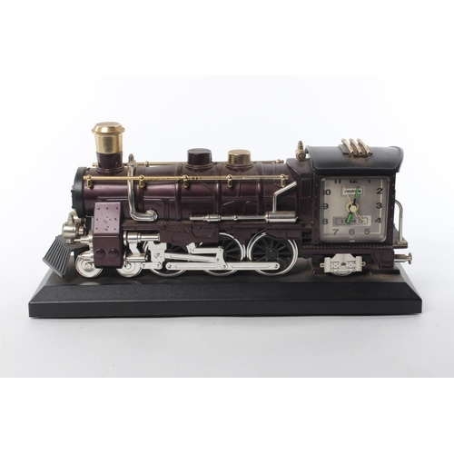 106 - A retro mantle clock in the form of a train, produced by Steepleton.