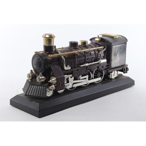 106 - A retro mantle clock in the form of a train, produced by Steepleton.