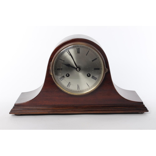 107 - A wood cased mantle clock with stamp for Jahresuhrenfabrik- Triberg, Germany.