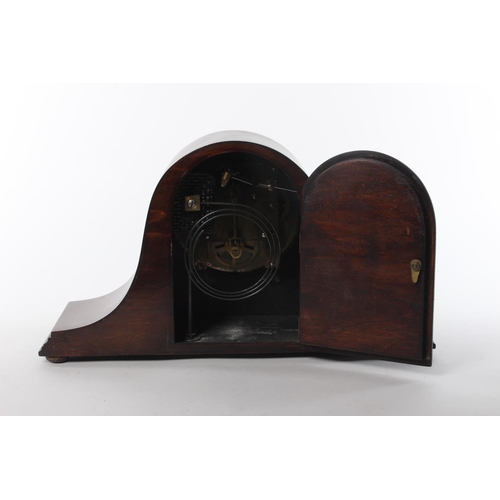 107 - A wood cased mantle clock with stamp for Jahresuhrenfabrik- Triberg, Germany.