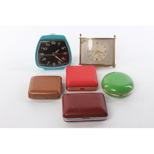 109 - An assortment of retro travelling clocks.