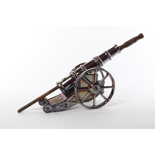 111 - A retro fire poker stand, modelled as a canon. Approx  45cm.