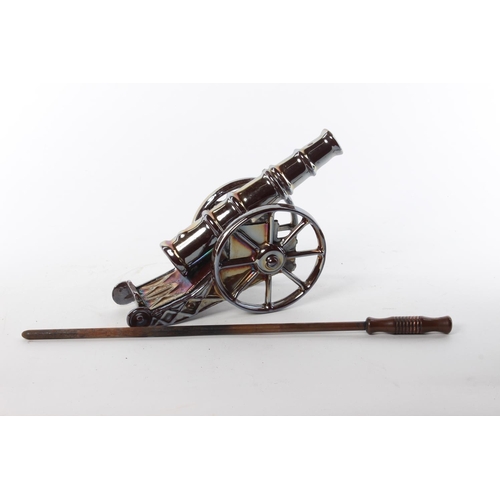 111 - A retro fire poker stand, modelled as a canon. Approx  45cm.