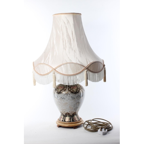 117 - A vintage table lamp and shade.