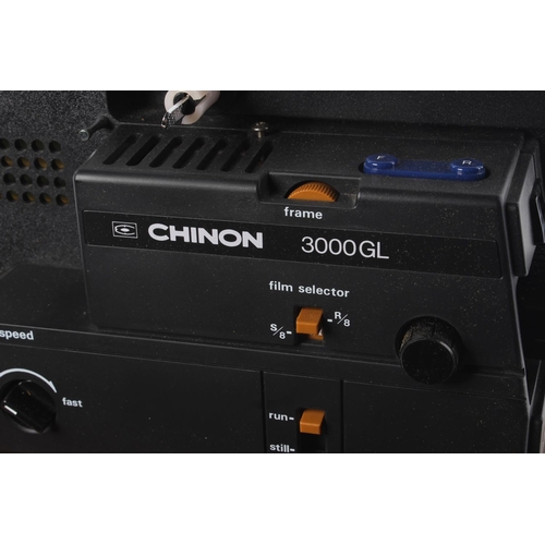 119 - A Chinon 3000GL projector and wooden case.