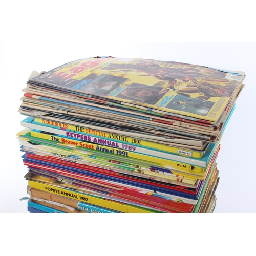 121 - A large assortment of annuals and comics.