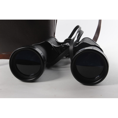 123 - A set of vintage field glasses binoculars with original leather bound case.