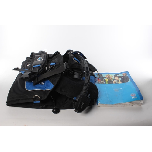 129 - A scuba diving kit and open water diver manual.