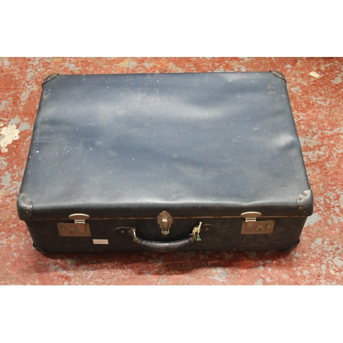 131 - A vintage suitcase.